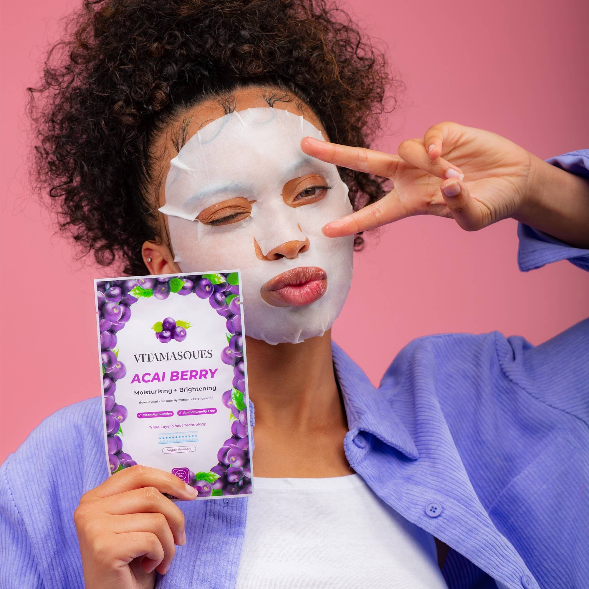 Acia Berry Korean Face Mask shown in hand, highlighting its moisturizing and brightening benefits, ideal for dull skin, featuring acai berry extract and aloe vera.