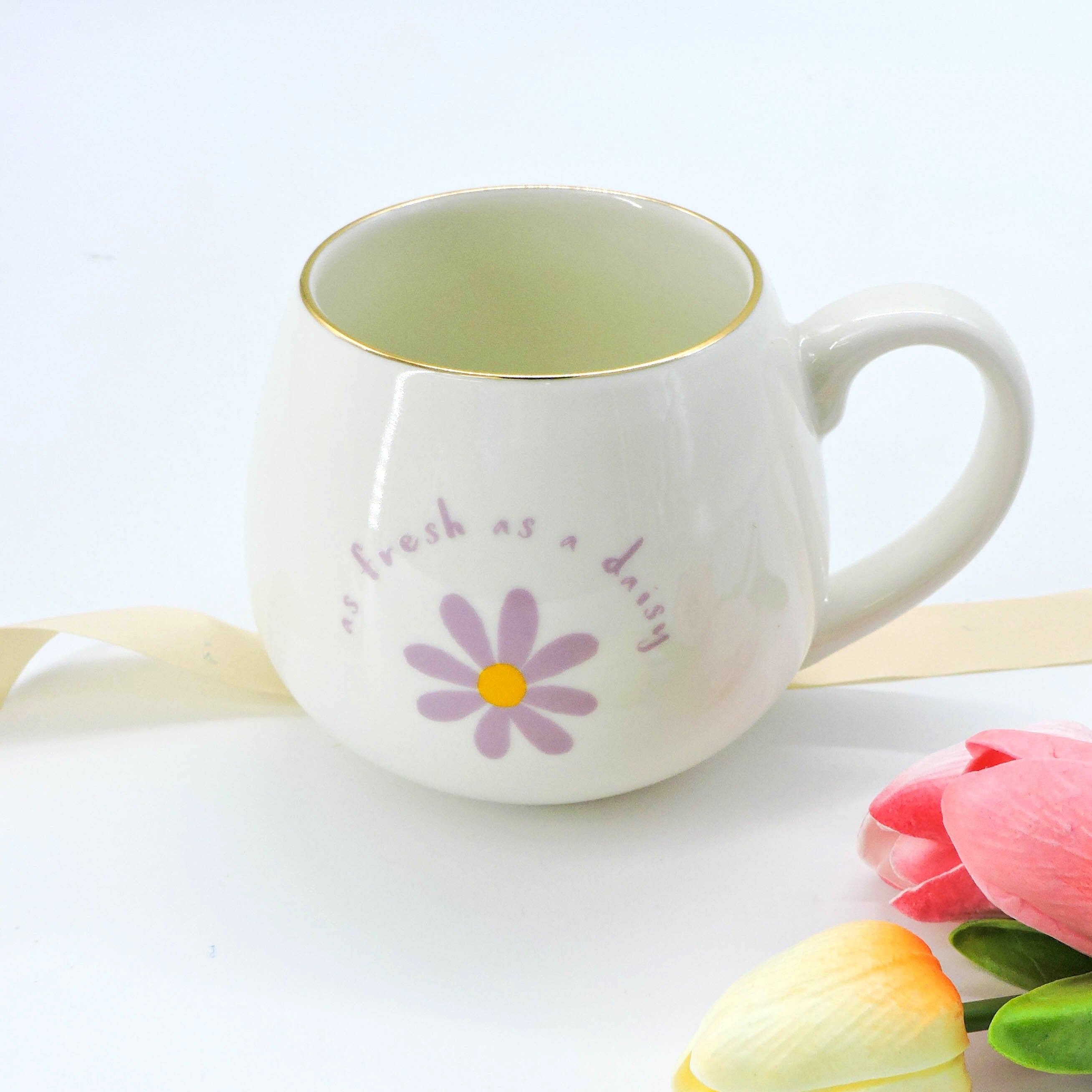 As Fresh as a Daisy Ceramic Mug with daisy print and gold-rimmed details, ideal for coffee or tea, enhancing mornings with floral charm.