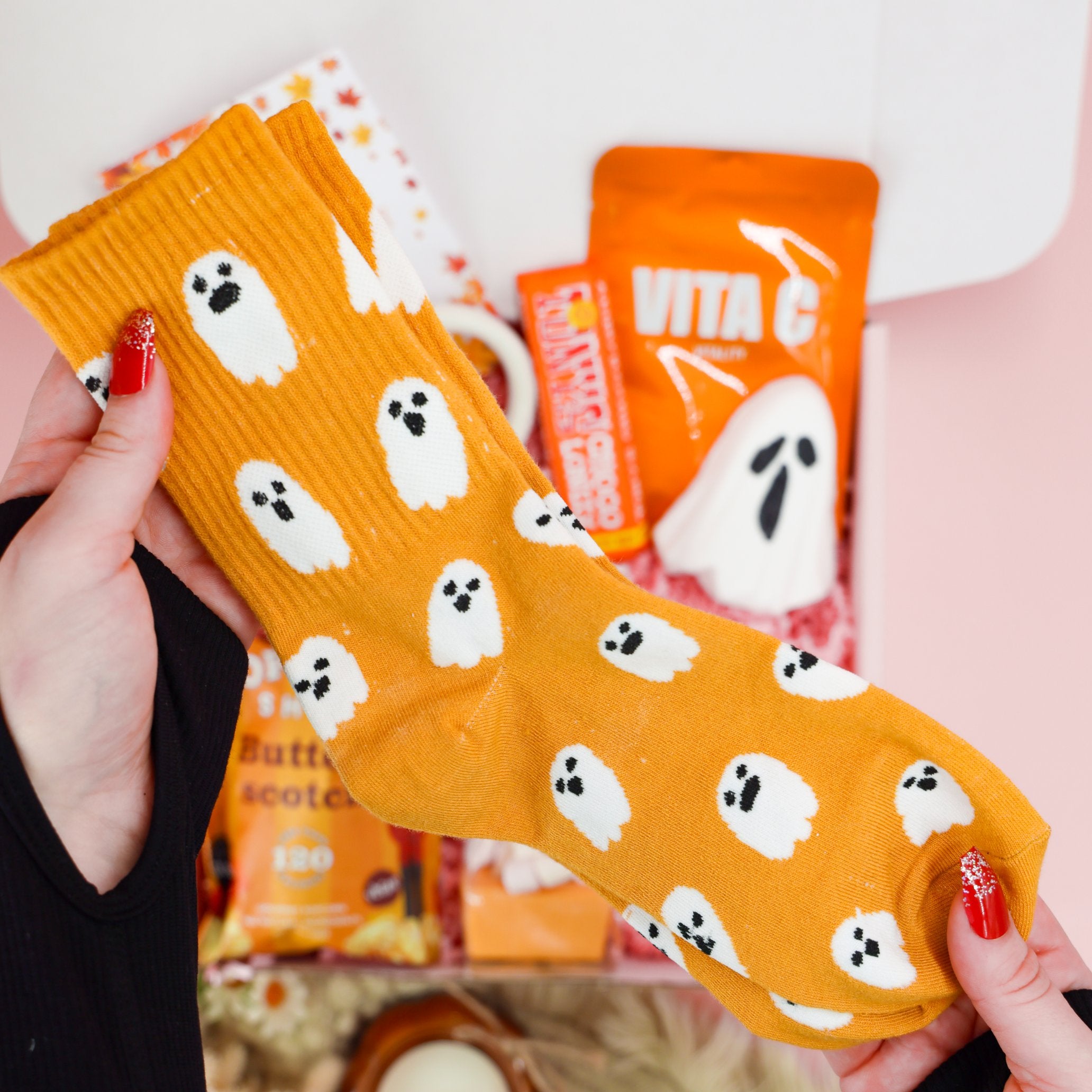 Autumn gifts for her – cosy Halloween hamper with mug, socks, and skincare