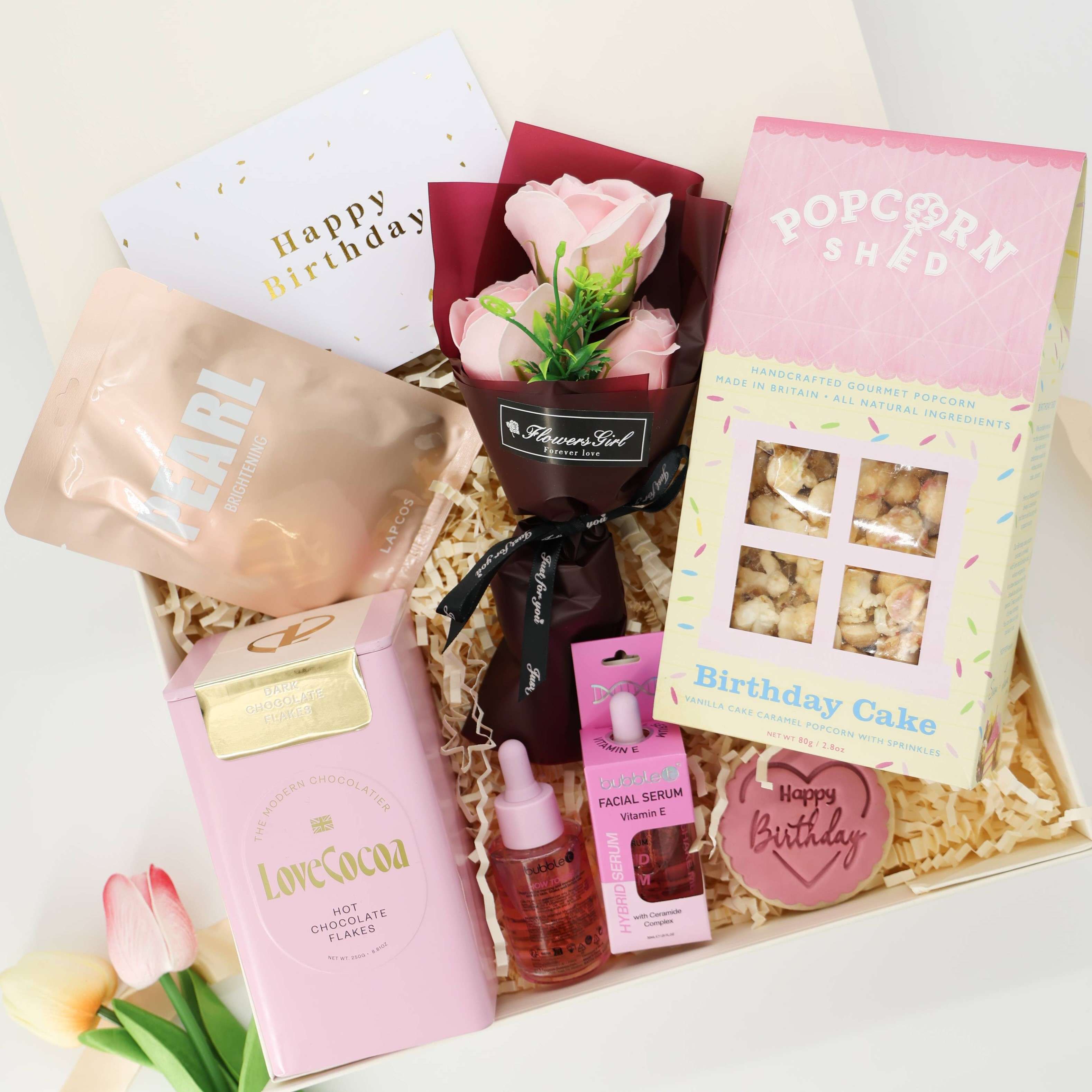 Pink Pamper Birthday Box – birthday gift for her with cake popcorn, floral bouquet, and skincare treats