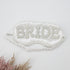 Bride Satin Sleep Mask adorned with sparkling rhinestones, elegantly designed for bridal moments, enhancing beauty and style during wedding preparations.