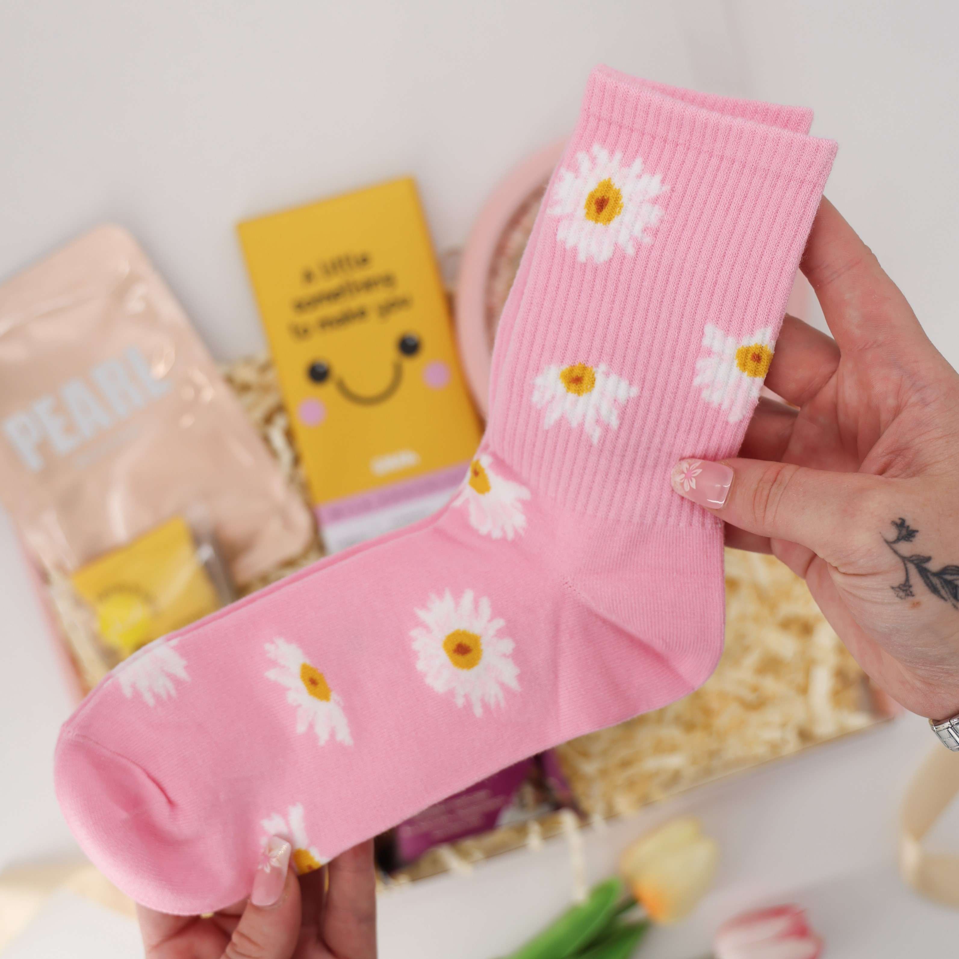 Uplifting pamper box with popcorn, skincare, and cosy treats