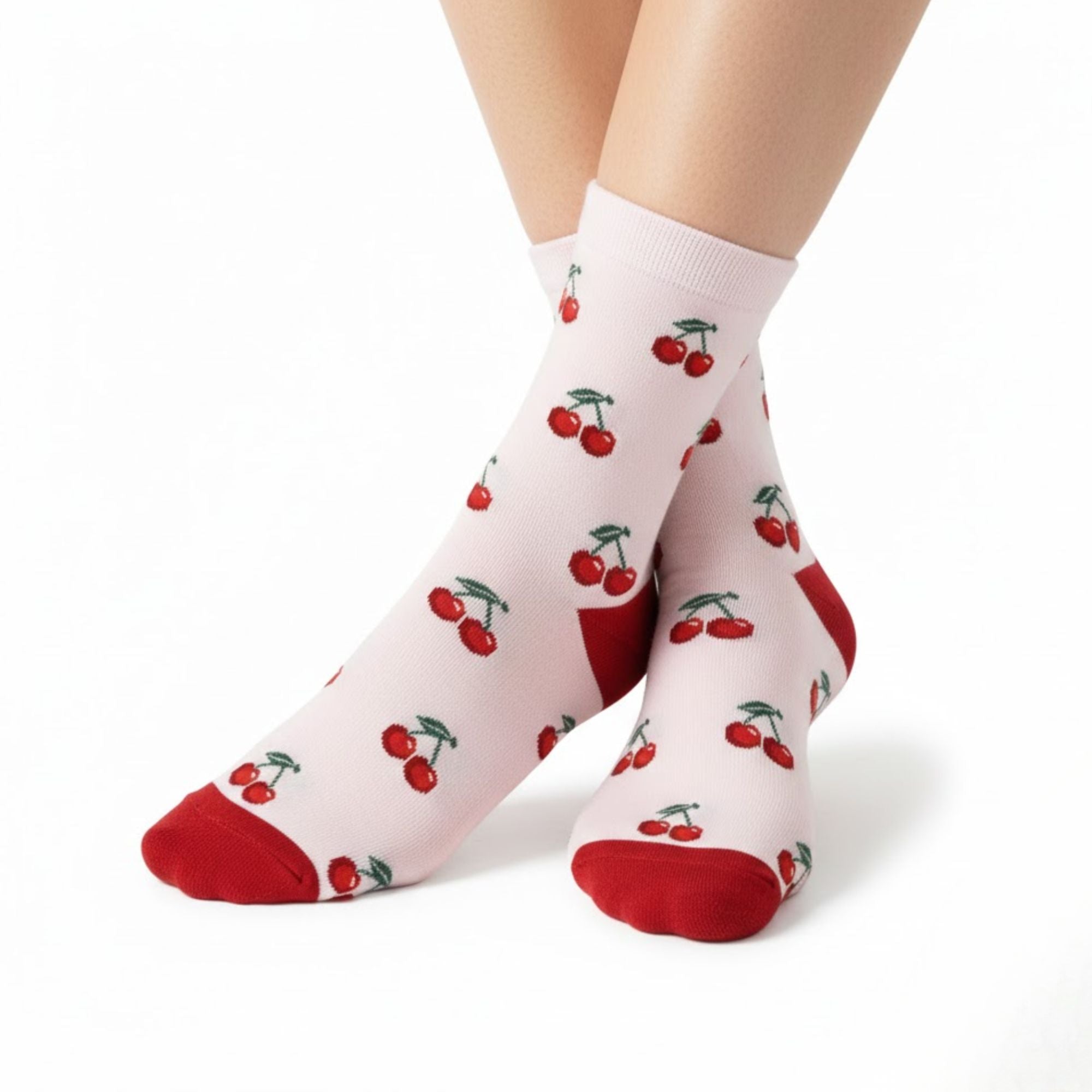 White socks with red cherry pattern worn by a person on a white background. Makes a perfect gift for her. sold by heavenly boxes
