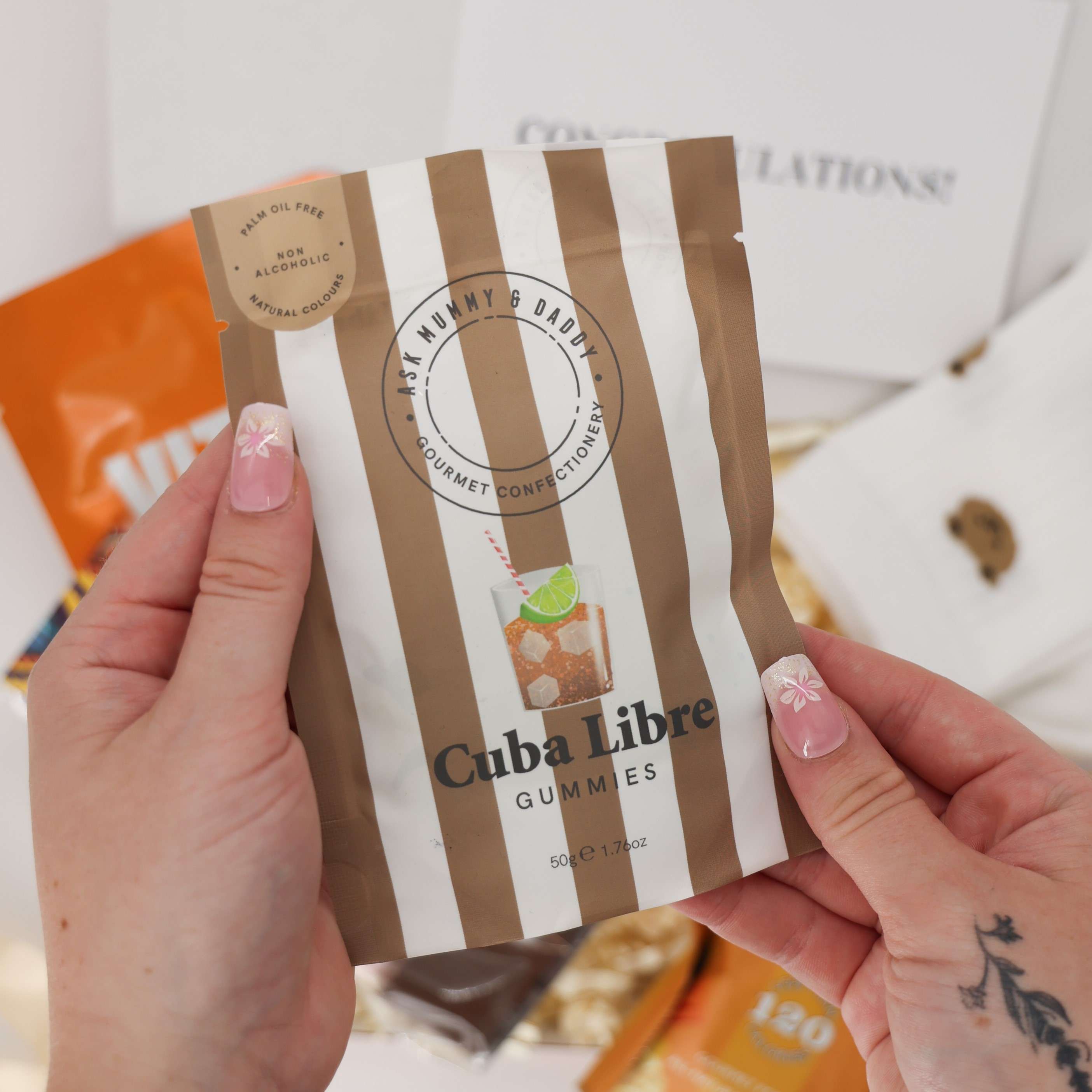 Self care box with congratulations card and hot chocolate stirrer.