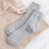 Cosy Heart Print Socks - Grey, featuring fluffy texture and subtle gold heart details, perfect for warmth and comfort at home or as a heartfelt gift.