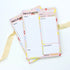 Daily Planner A5 Deskpad close-up showing floral layout with sections for scheduling, to-do lists, hydration tracking, and notes for enhanced organization.