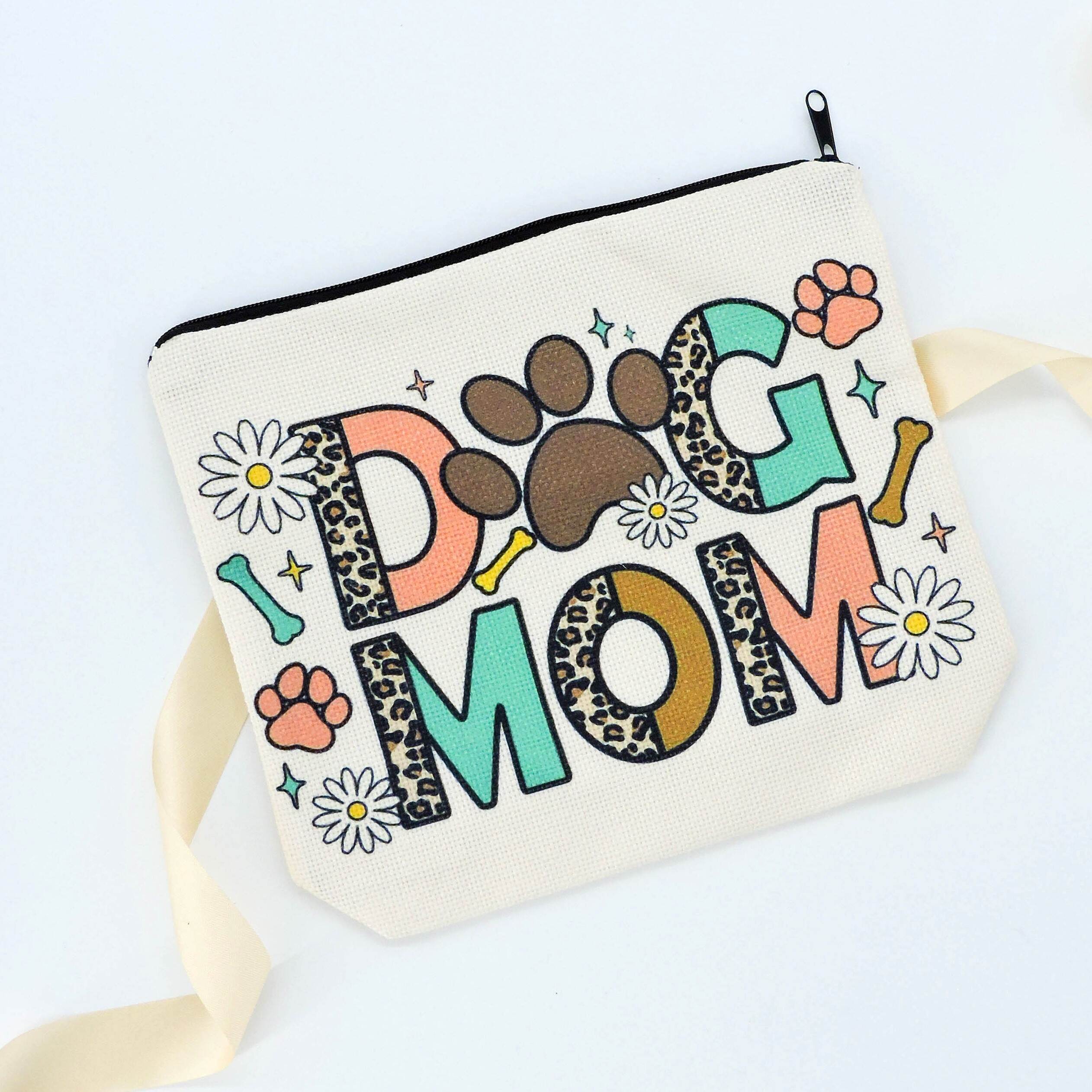 Dog Mom Pouch with cartoon florals and paw prints, ideal for makeup or treats, crafted from durable canvas, perfect for dog lovers.