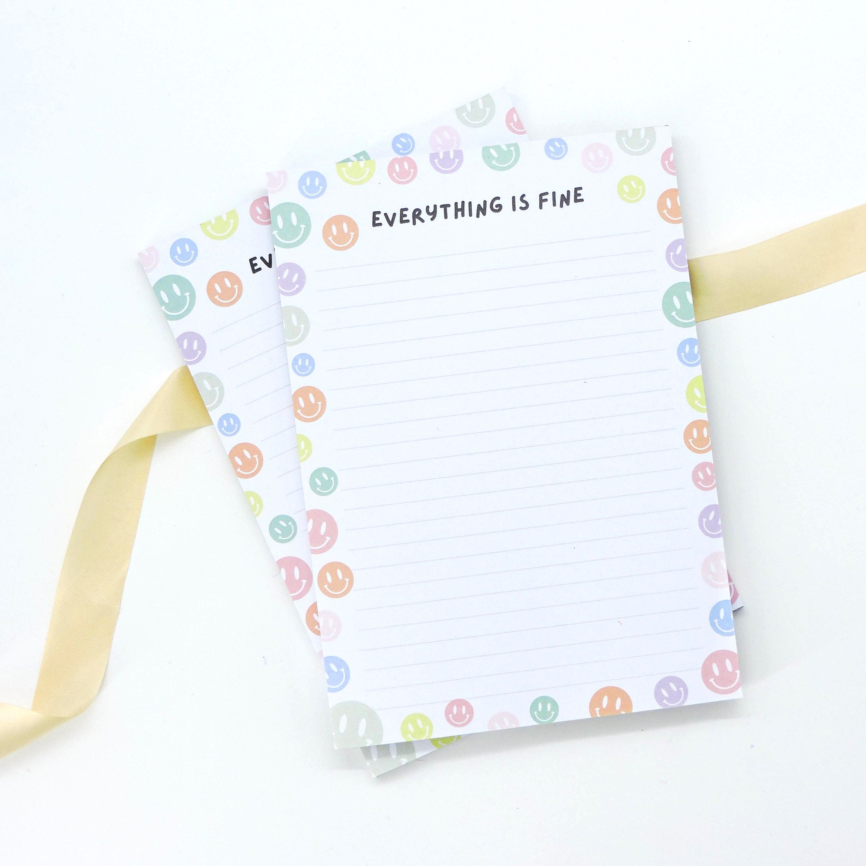 Everything is Fine A5 Deskpad with colorful smiley face border, ideal for notes and reminders, perfect for adding a cheerful touch to any workspace.