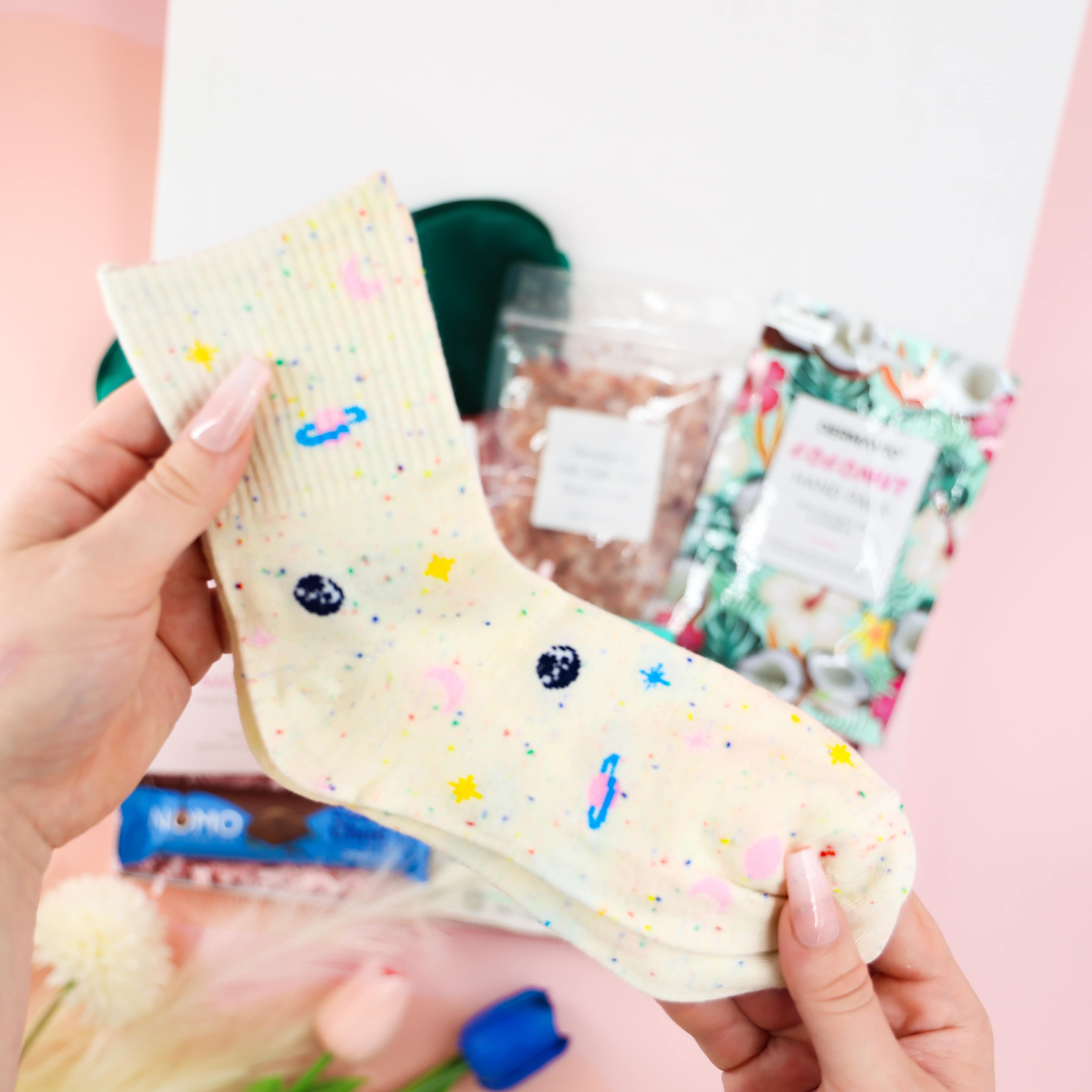 Feel-Good Care Package cosy speckled cream socks with pastel stars and planets—wellness and comfort gift for her.