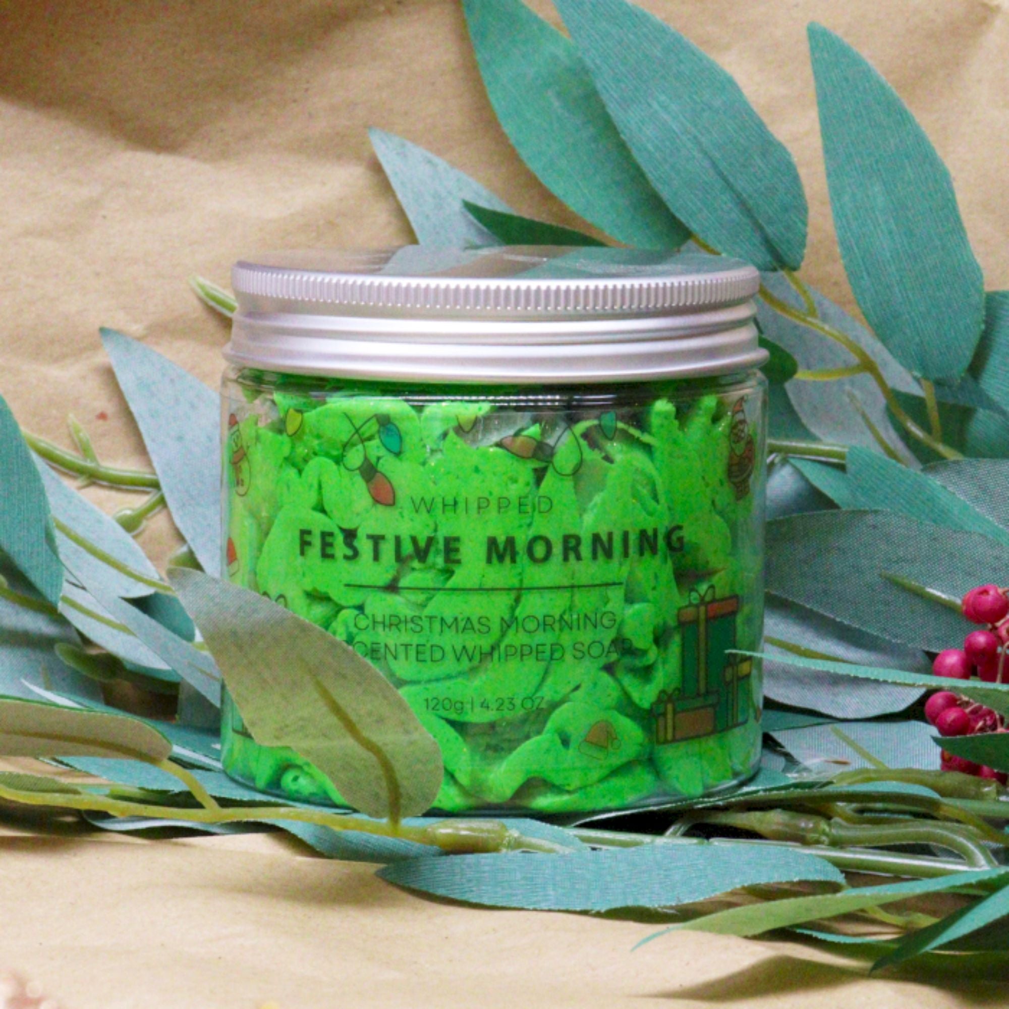 Festive Morning Scented Whipped Soap in a mason jar with a white lid, featuring a velvety texture and delicate sugar Christmas tree decorations for holiday pampering.