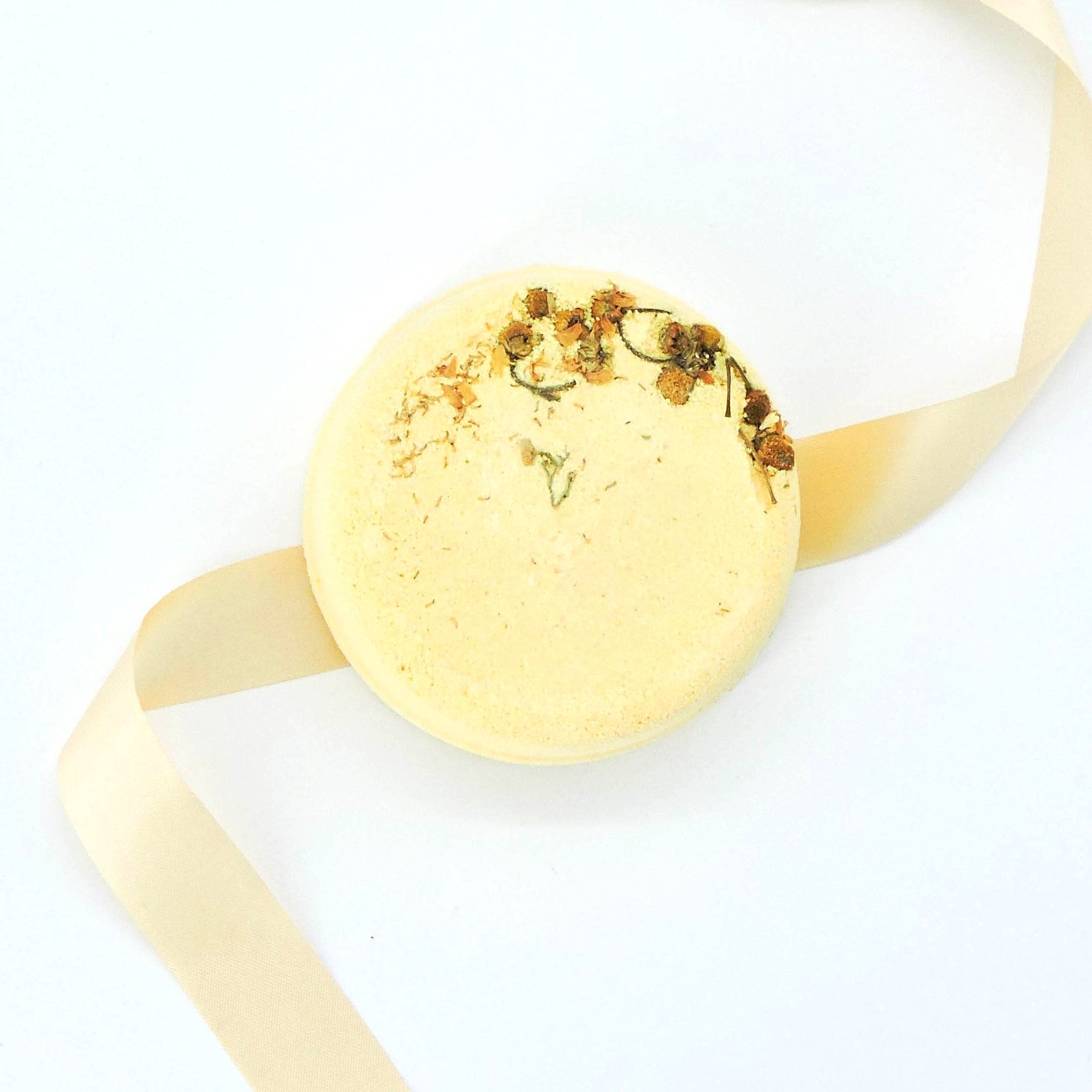 Floral Fizz Shower Steamer close-up, featuring intricate dried botanicals, offering a spa-like, aromatic experience with calming essential oils for relaxation in the shower.