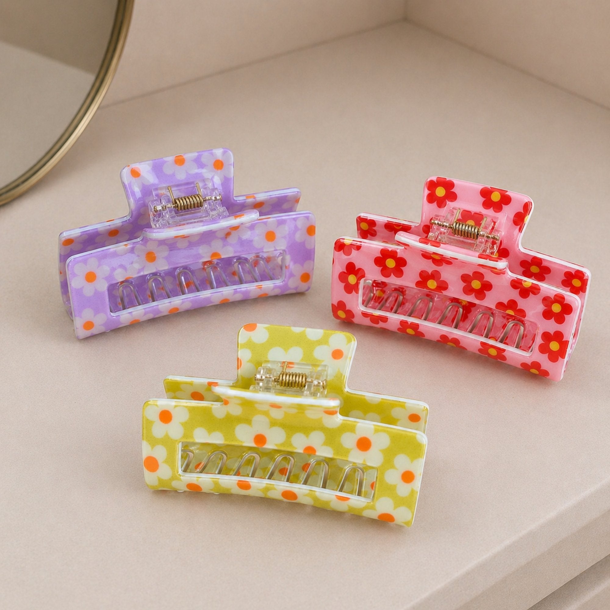 Floral Print Hair Clip showcasing vibrant floral patterns with a sturdy grip, ideal for adding color to any hairstyle.