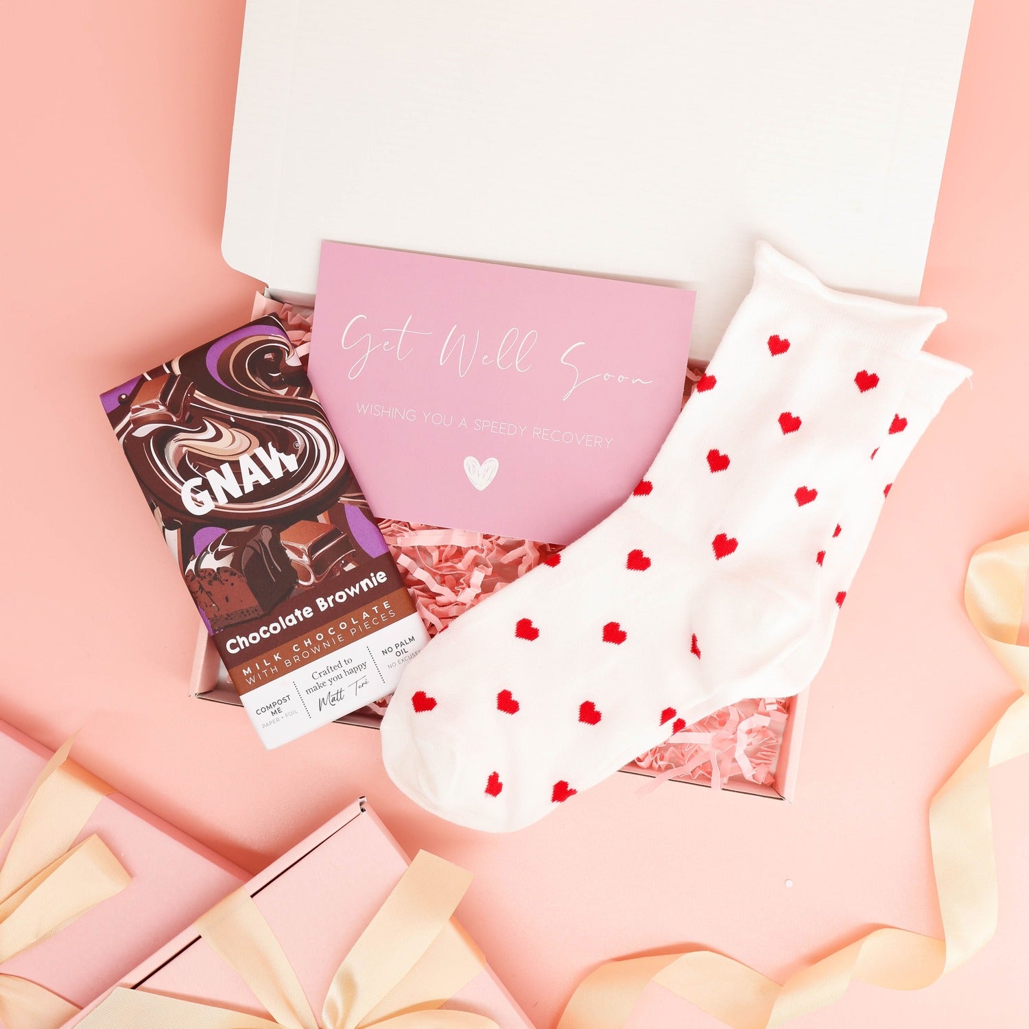 get well soon gift – small pink treat box with cosy socks and chocolate brownie bar