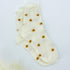 Daisy Dots Socks featuring tiny golden daisy patterns and a gentle ruffle trim for a charming, cozy look, ideal for any casual or gift occasion.