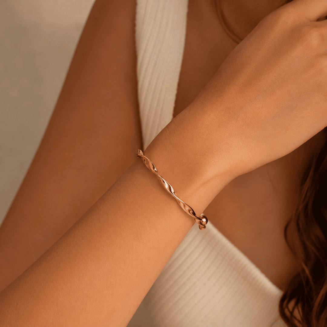 gifts for her – rose gold twisted bangle bracelet with polished finish