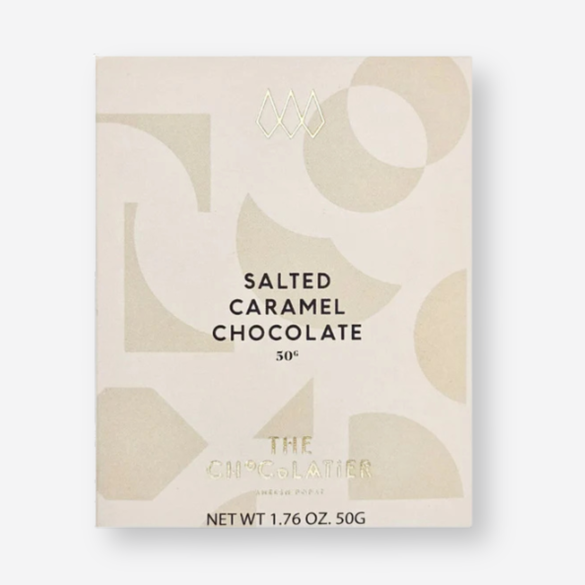 The Chocolatier Salted Caramel Chocolate bar in elegant cream packaging with abstract shapes and pale gold ribbon, perfect for gifting and indulgence.
