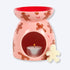 Gingerbread Wax Melt Burner featuring a smiling gingerbread man design with candy cane accents and a red bowl, includes an eco-friendly gingerbread man soy wax melt.