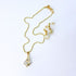Gold-Plated Crystal Pendant Jewelry Set featuring a close-up of a radiant gold chain and sparkling diamond earrings, ideal for special occasions or cherished gifts.