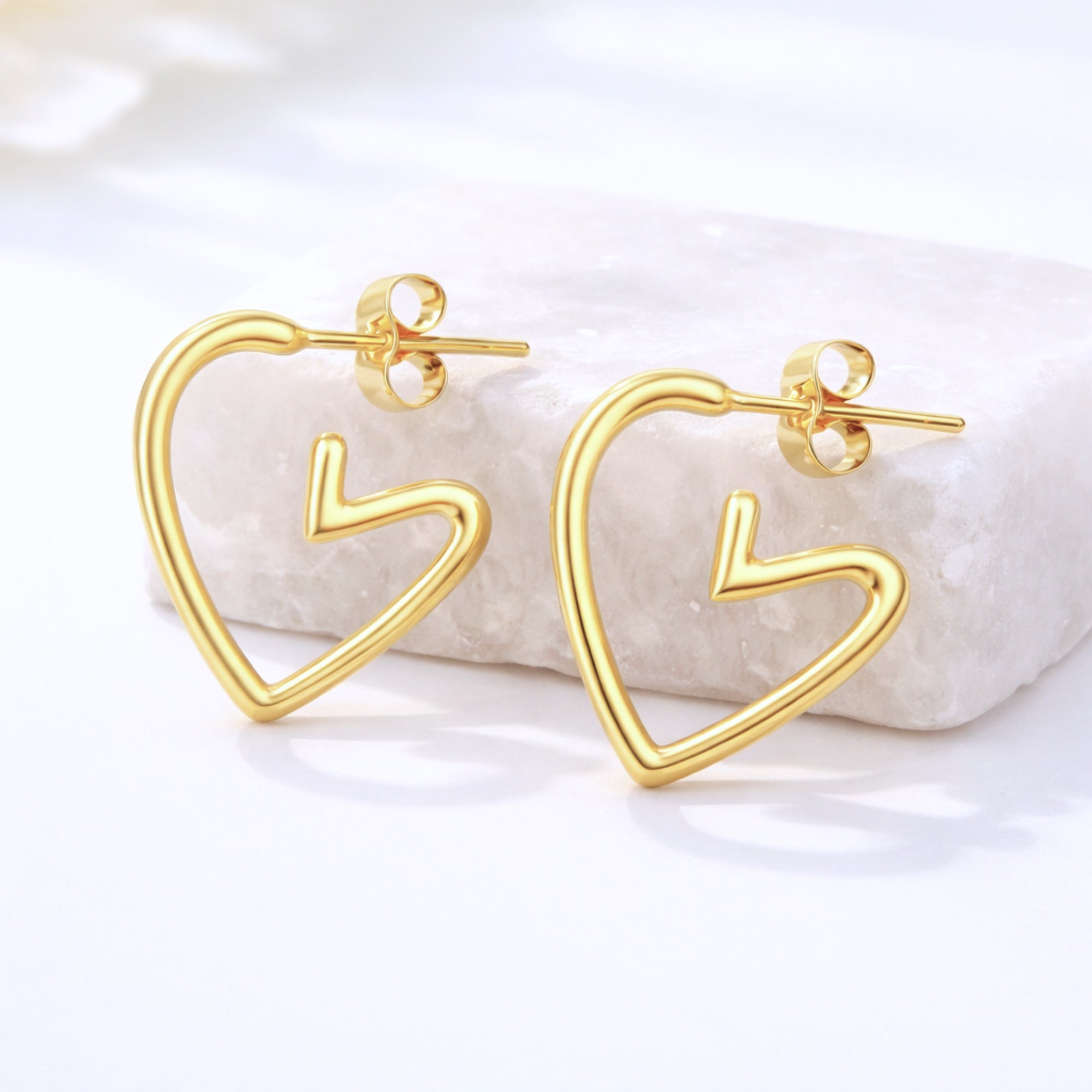 Gold Heart Earrings Charm with sleek open-heart design and hook fastening, offering a chic, elegant touch for gifting or everyday wear.