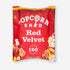 Popcorn Shed Red Velvet: A red bag of red velvet cake-flavored popcorn with visible white chocolate pieces and cream cheese frosting.