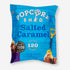 Popcorn Shed Salted Caramel packaging with a prominent logo, showcasing gourmet popcorn made with sea-salted caramel and creamy Belgian milk chocolate. Suitable for vegetarians, gluten-free.