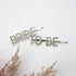 Bride To Be Crystal Hair Pins with silver-toned rhinestones spelling “BRIDE” and “TO BE,” perfect for bridal events, offering a bold, elegant touch.