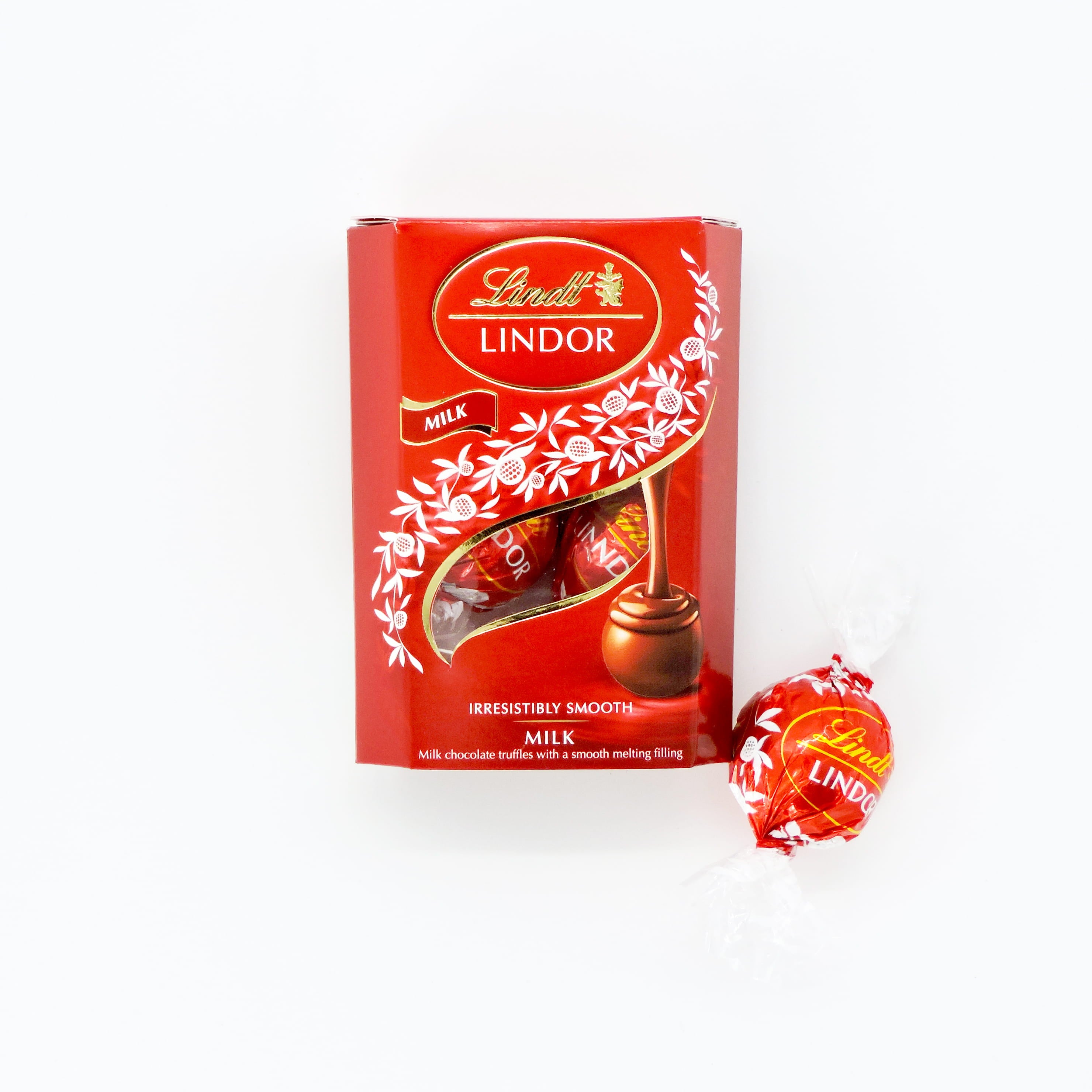 Lindt Milk Chocolate Treat close-up, showcasing its smooth, creamy texture and luxurious Swiss chocolate finish, ideal for indulging or gifting.