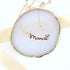 Mama Necklace with Heart: A close-up of a gold necklace featuring a Mama pendant and a delicate heart charm, symbolizing love and appreciation for mothers.
