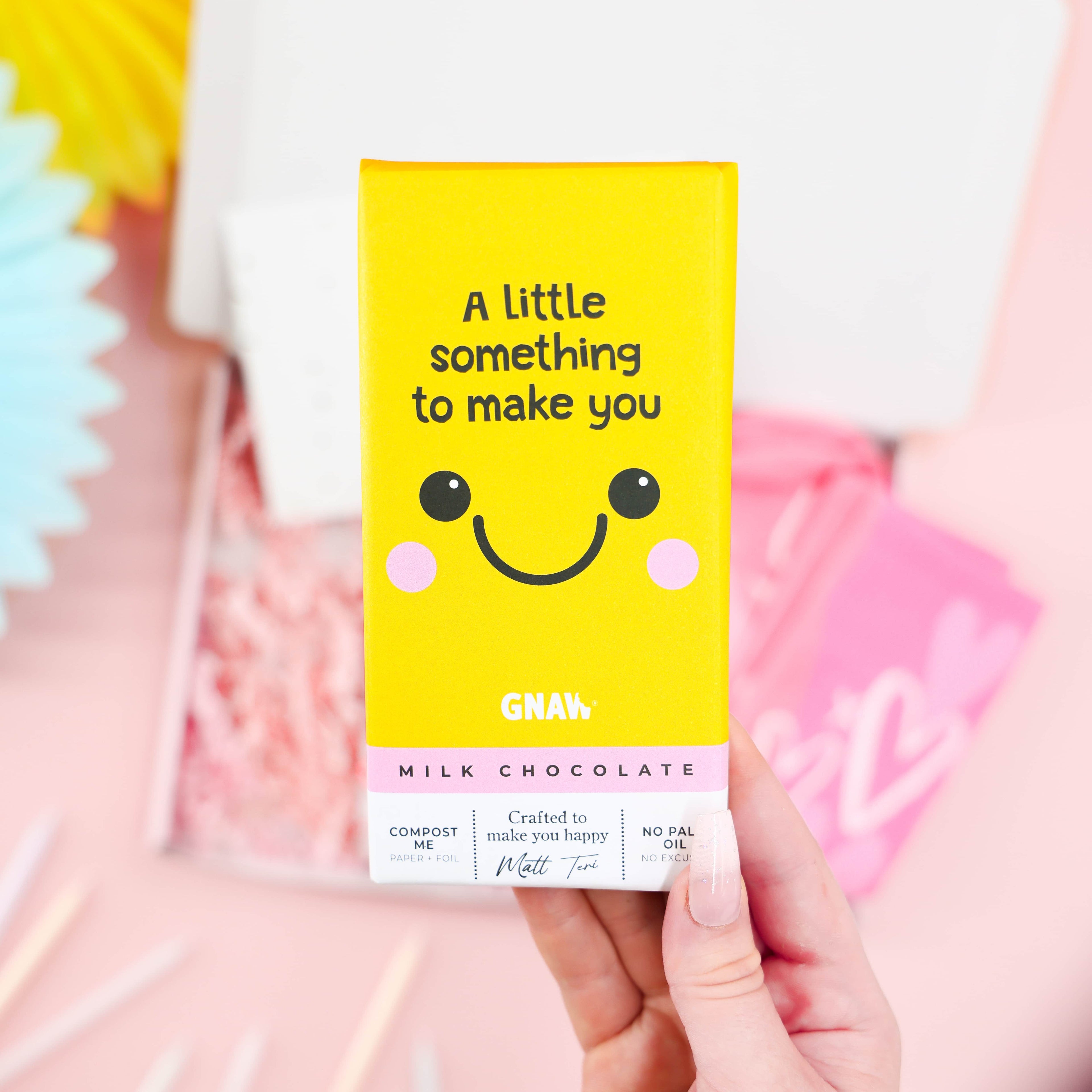 Pink themed Mini Birthday Pamper & Treats Gift Box – cosy socks, skincare, and chocolate bar for her birthday.