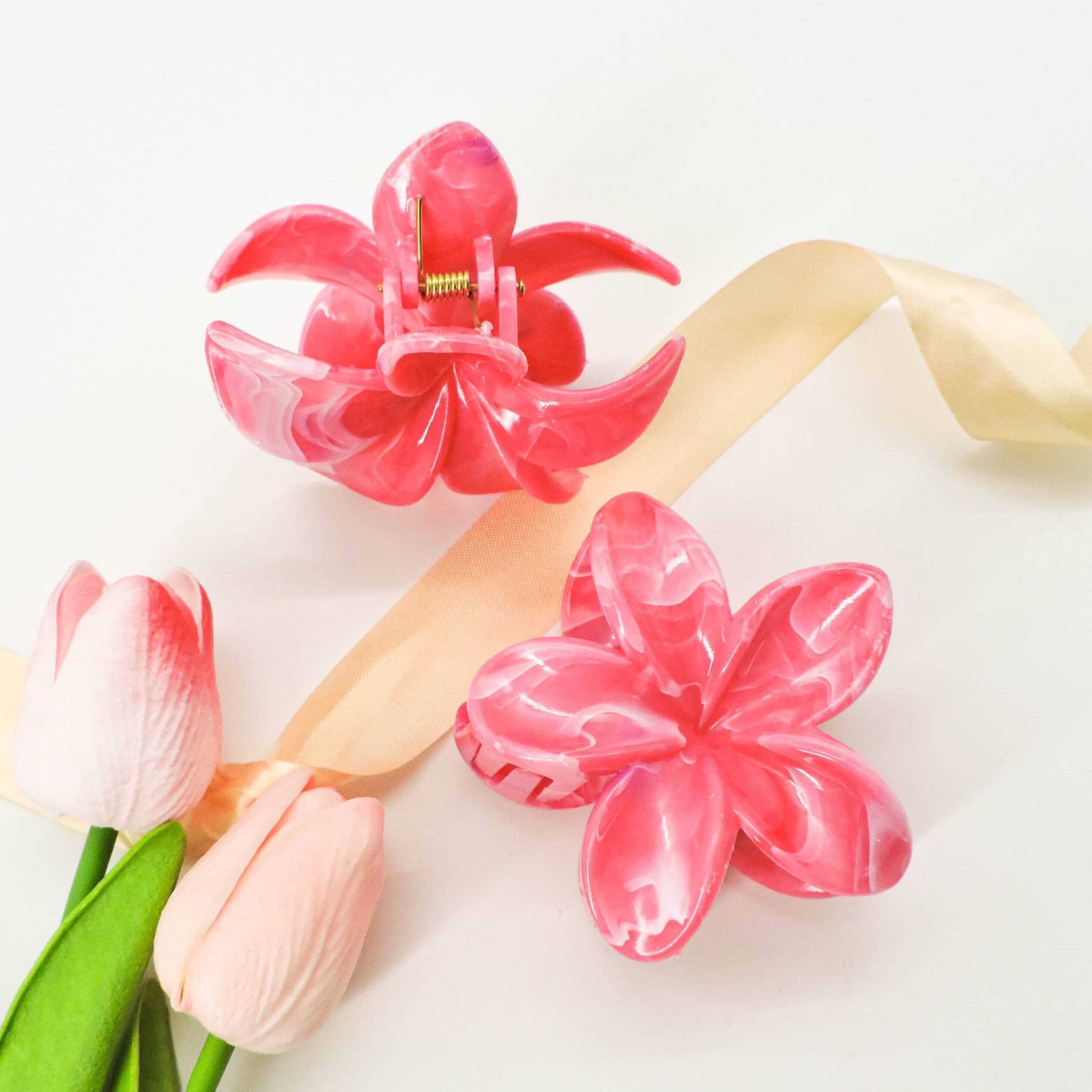 Pink Flower Hair Clip with a soft floral design and sturdy claw grip, perfect for securing hair stylishly for everyday wear or special occasions.