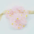 Daisy Hair Scrunchie - Pink: A soft, floral scrunchie adorned with daisy patterns, ideal for adding a feminine touch to hairstyles or as a wrist accessory.