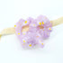 Daisy Hair Scrunchie - Purple: A purple organza scrunchie adorned with white daisies, offering a lightweight and elegant hold for various hairstyles.