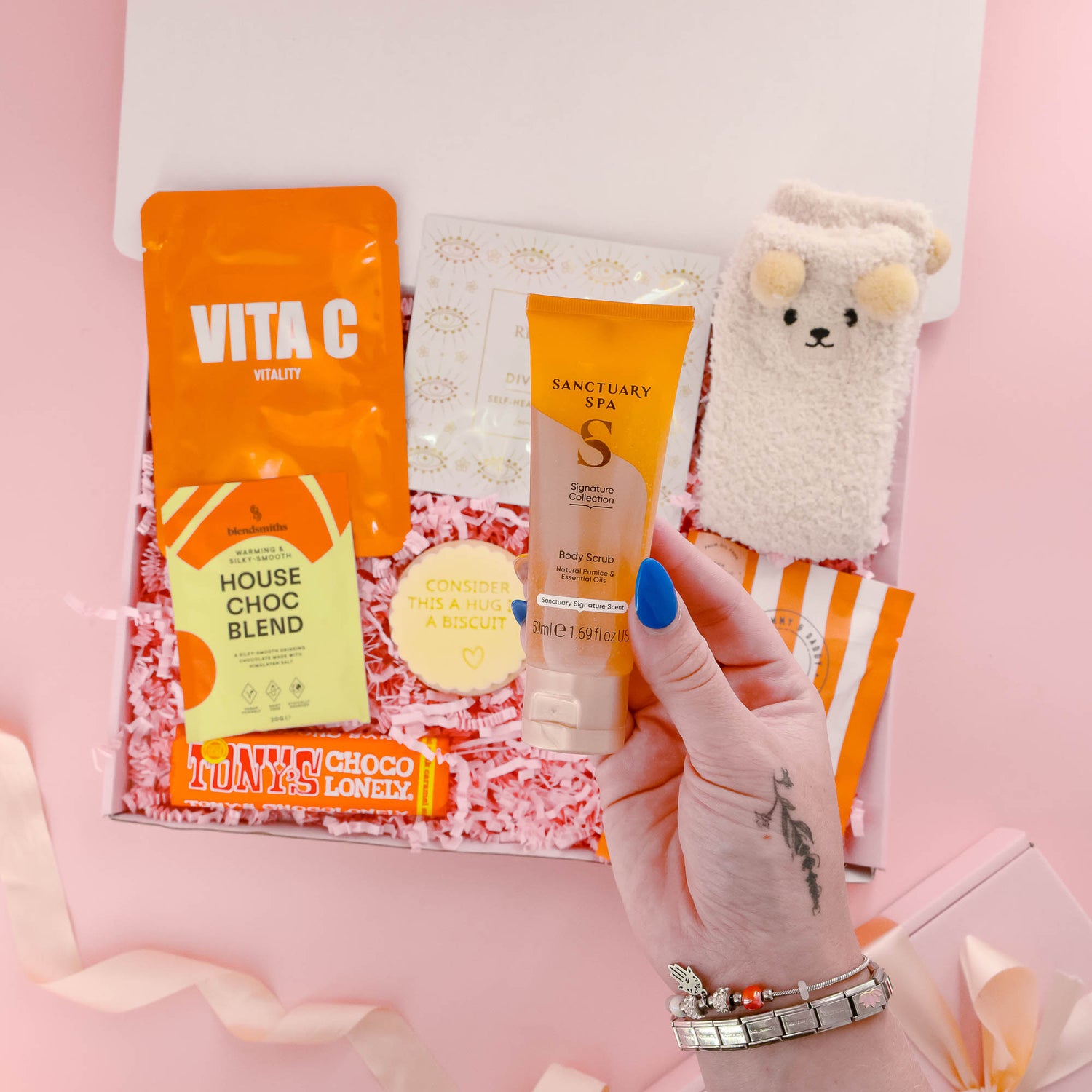 Luxury gift for her with Sanctuary Spa body scrub, chocolate, gummies, and a curated mix of pamper products for a relaxing self care night.