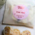 Rose Oud Wax Melt: Close-up of four hand-poured soy wax melts, featuring a luxurious oriental floral scent with notes of rose, oud, and jasmine.