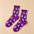 Halloween Ghost Print Socks - Purple featuring playful white ghost designs, ideal for adding a spooky touch to your sock collection. Perfect for Halloween enthusiasts.