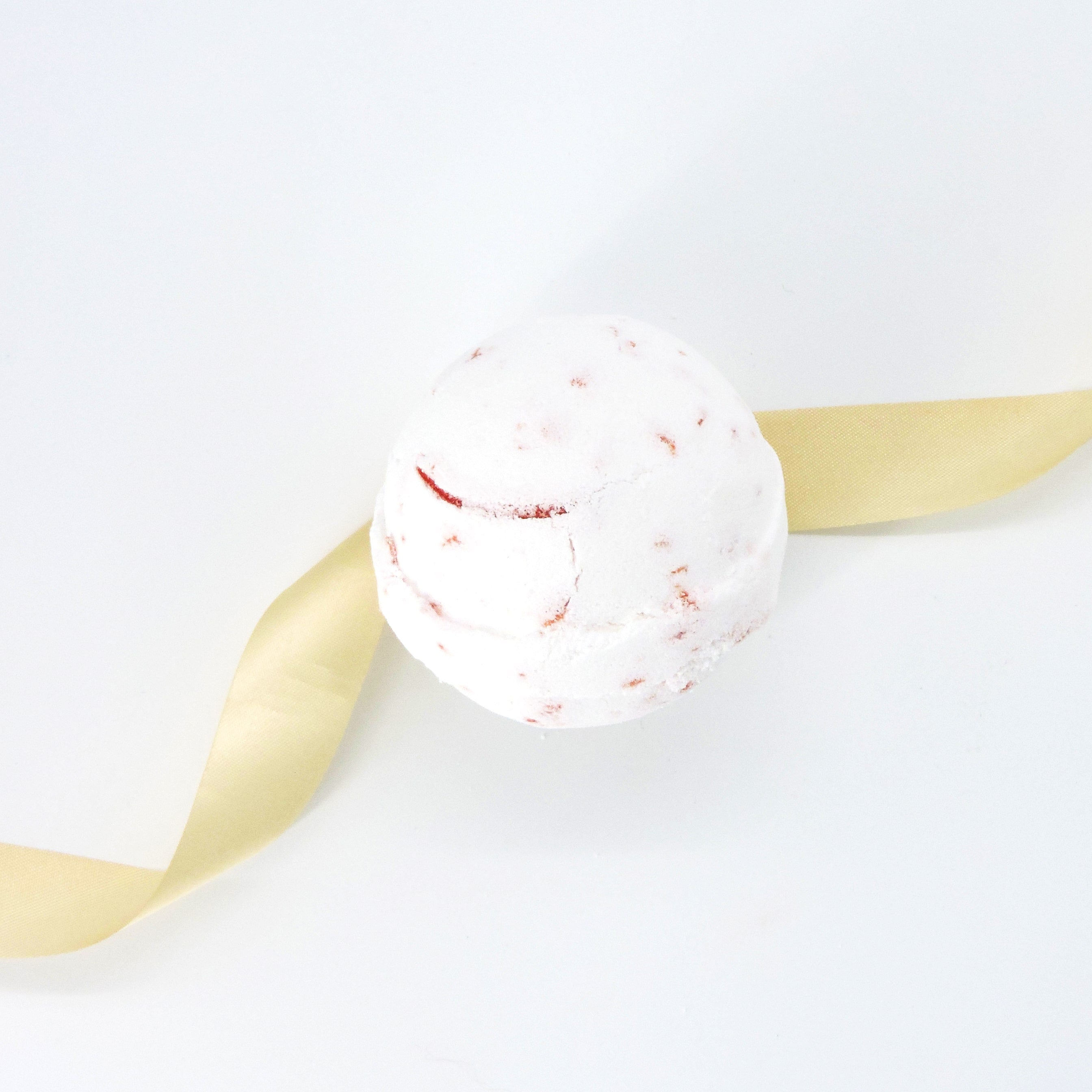 Close-up of the Tropical Paradise Bath Bomb, showcasing its textured surface, hinting at its aromatic dragon fruit, papaya, and mangosteen infusion for a luxurious bath experience.