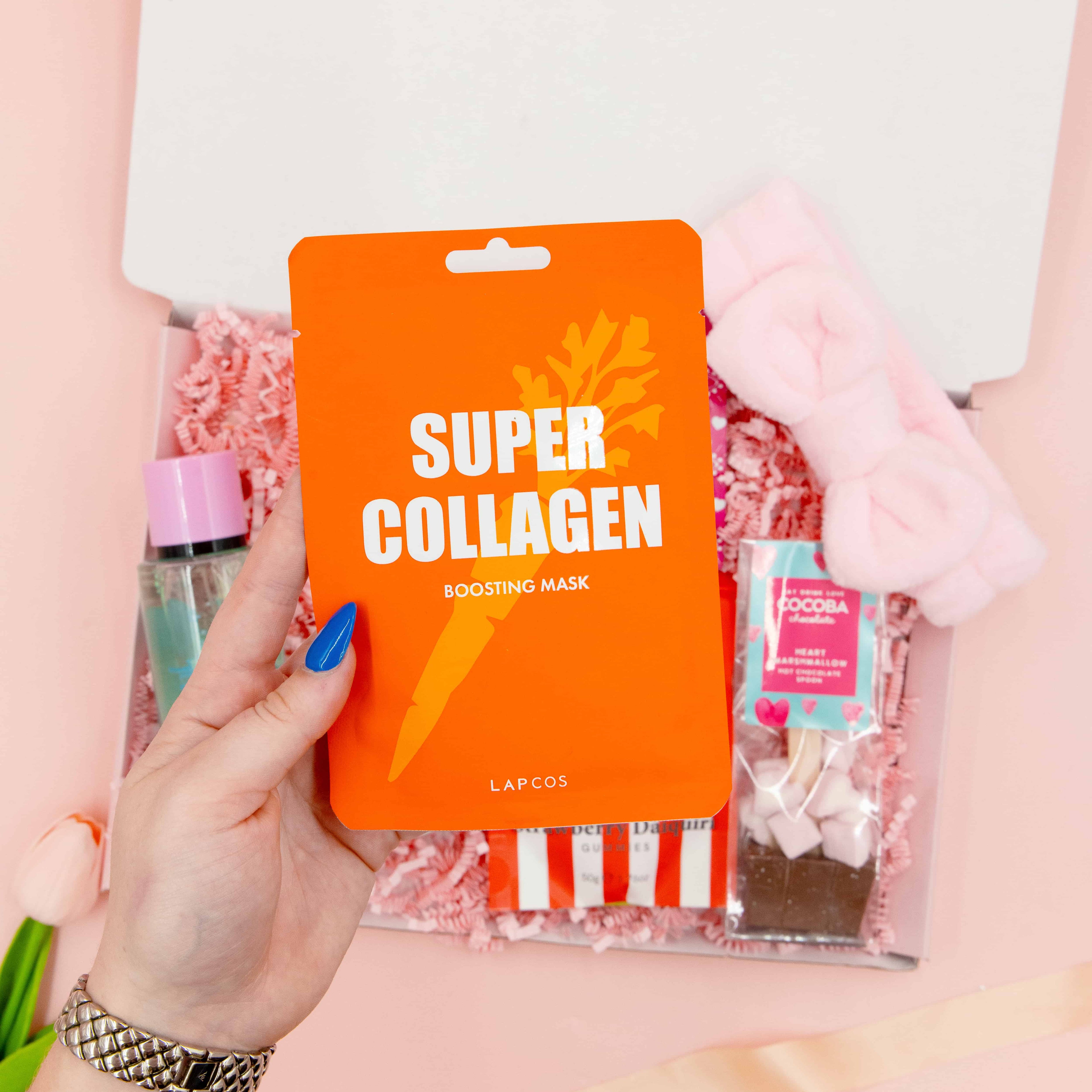 Treat Yourself Tonight gift box for her – collagen face mask, cosy headband, hot chocolate with marshmallows, strawberry sweets and self-care treats.