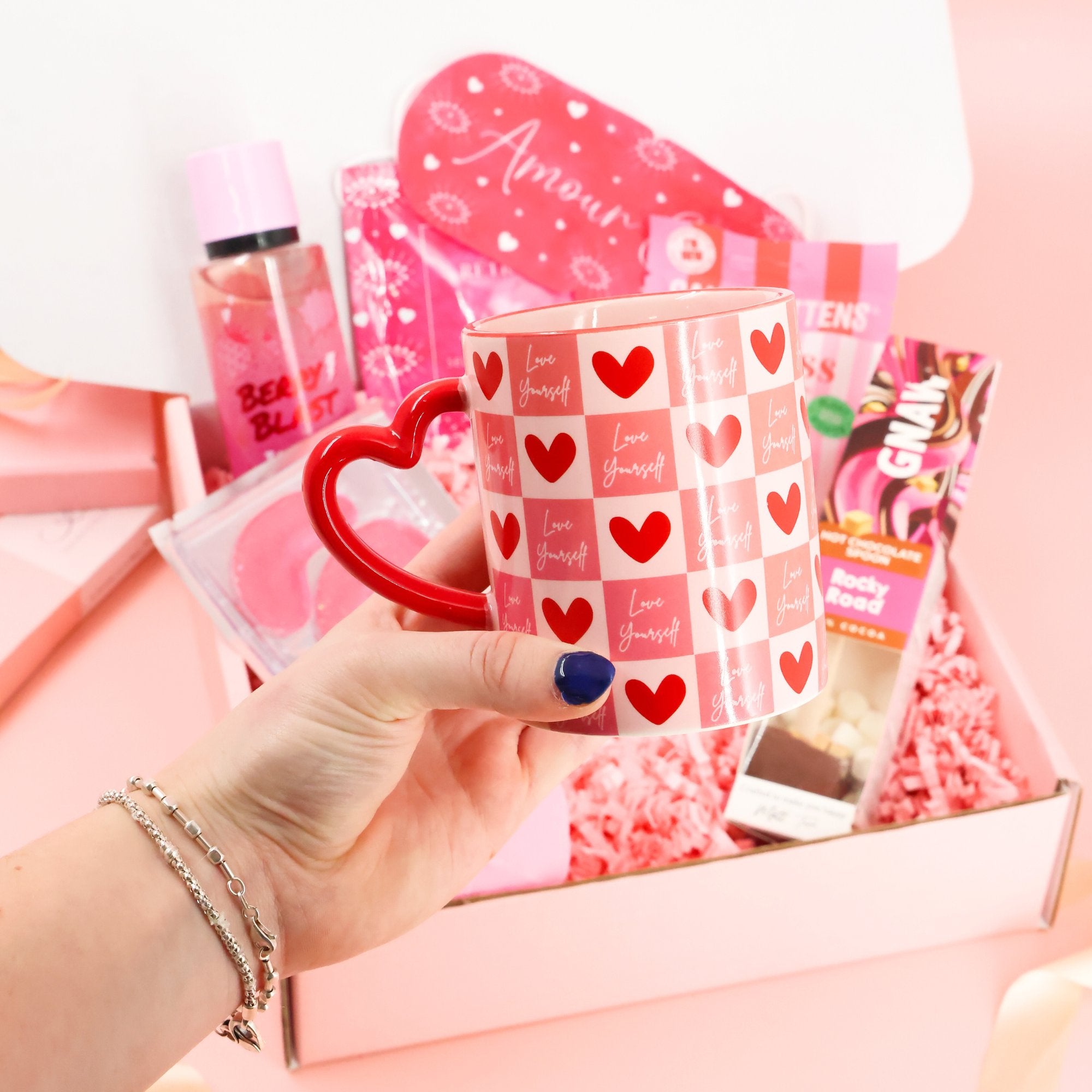 Aesthetic "Love Yourself" ceramic mug with a heart-shaped handle, part of a luxury self-care gift set for relaxation and mental health.