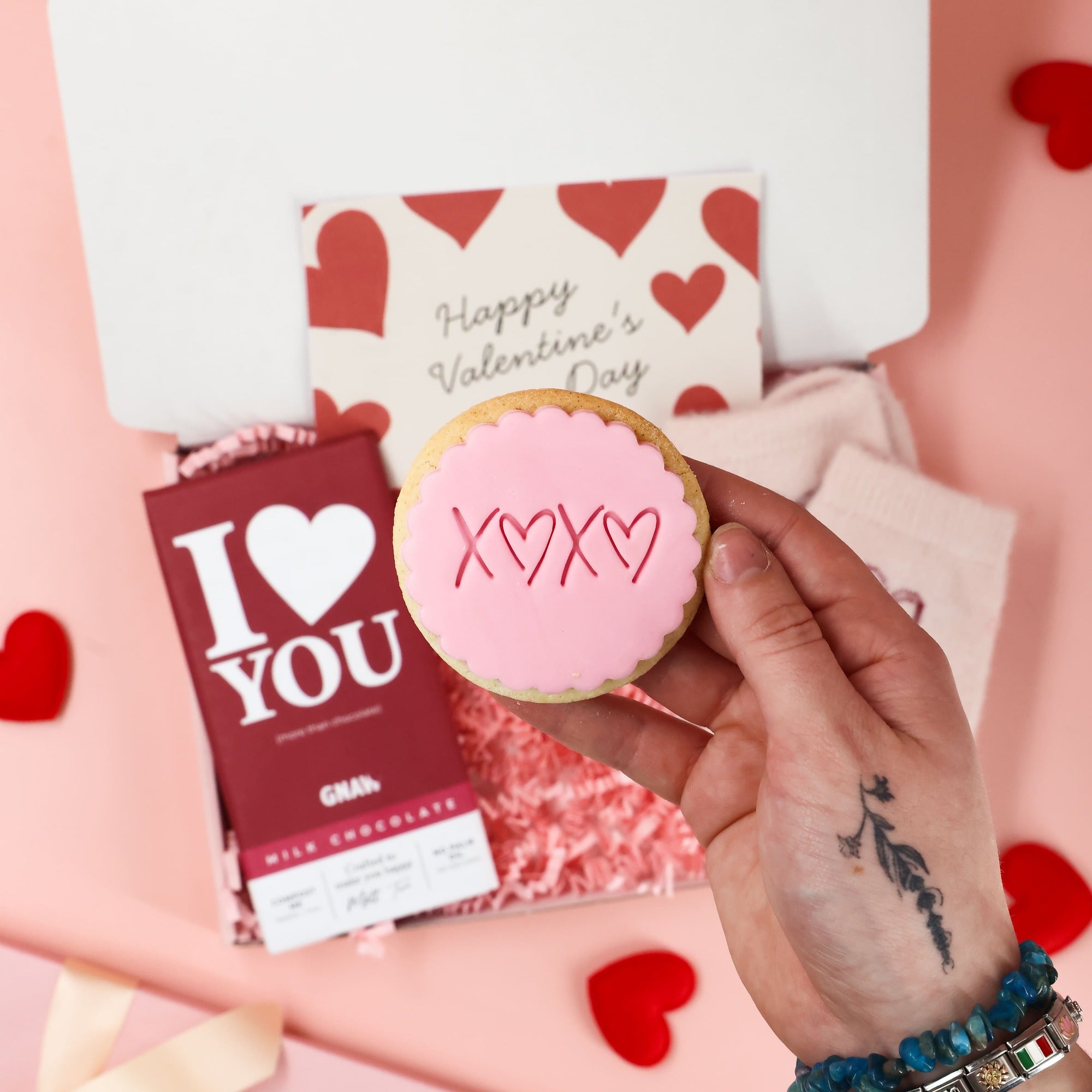 Thinking of You valentines gift box for her with cosy accessories and sweet treats displayed inside