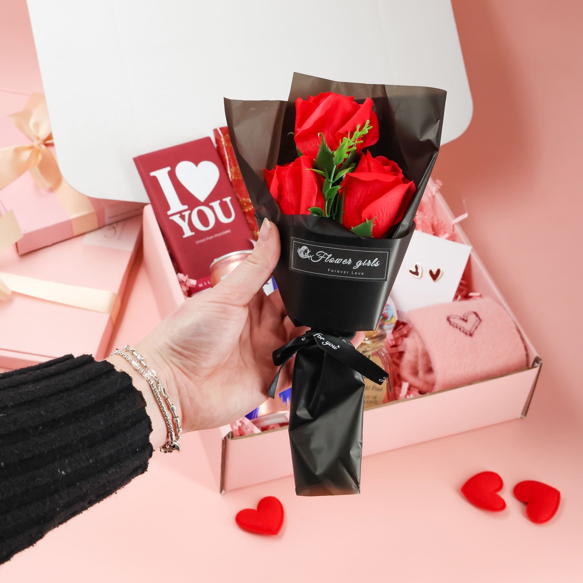 Forever Yours valentines gift for her displayed with self care items, sweet snacks and Valentine packaging