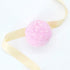 Watermelon Tropical Coco Bath Bomb adorned with a yellow ribbon, promises a watermelon scent and coconut oil for a refreshing, luxurious bath experience.