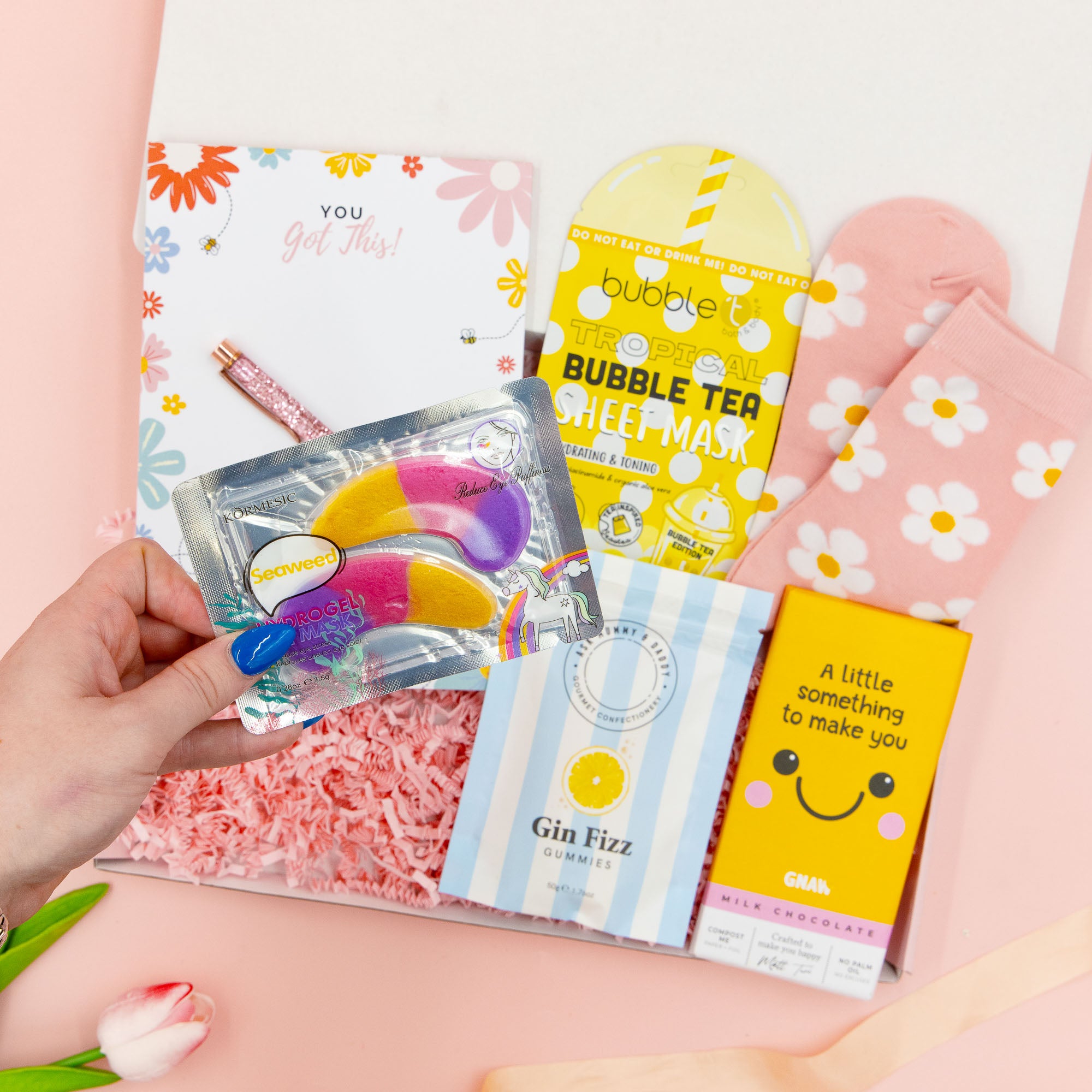 You’ve Got This Box – positive gift for her with hydrogel eye masks, tropical sheet mask, chocolate, sweets, stationery and daisy socks – uplifting pamper gift.