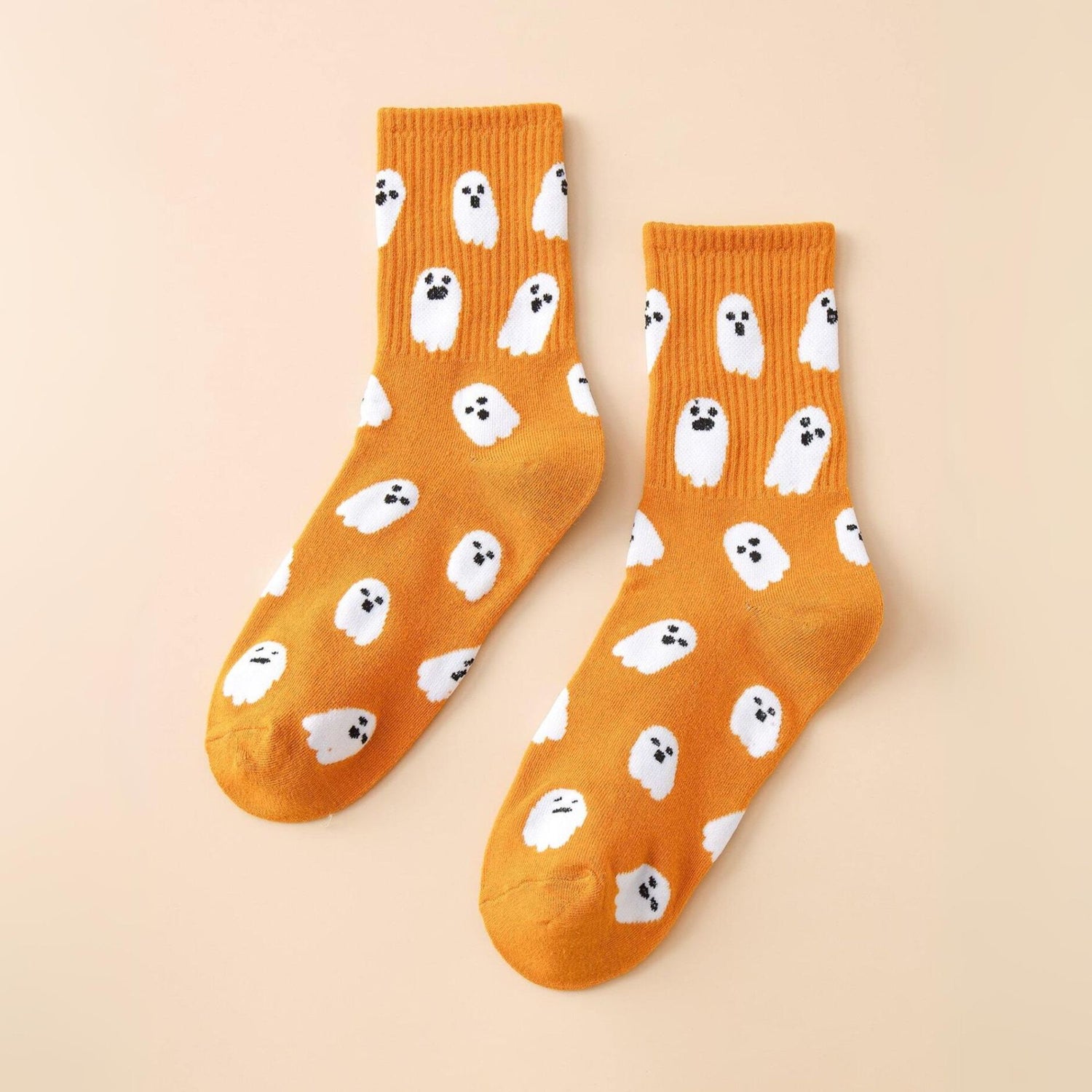 Ghost Pattern Socks featuring playful white ghosts. These mid-calf socks add festive charm and spooky fun, ideal for Halloween or quirky everyday wear.
