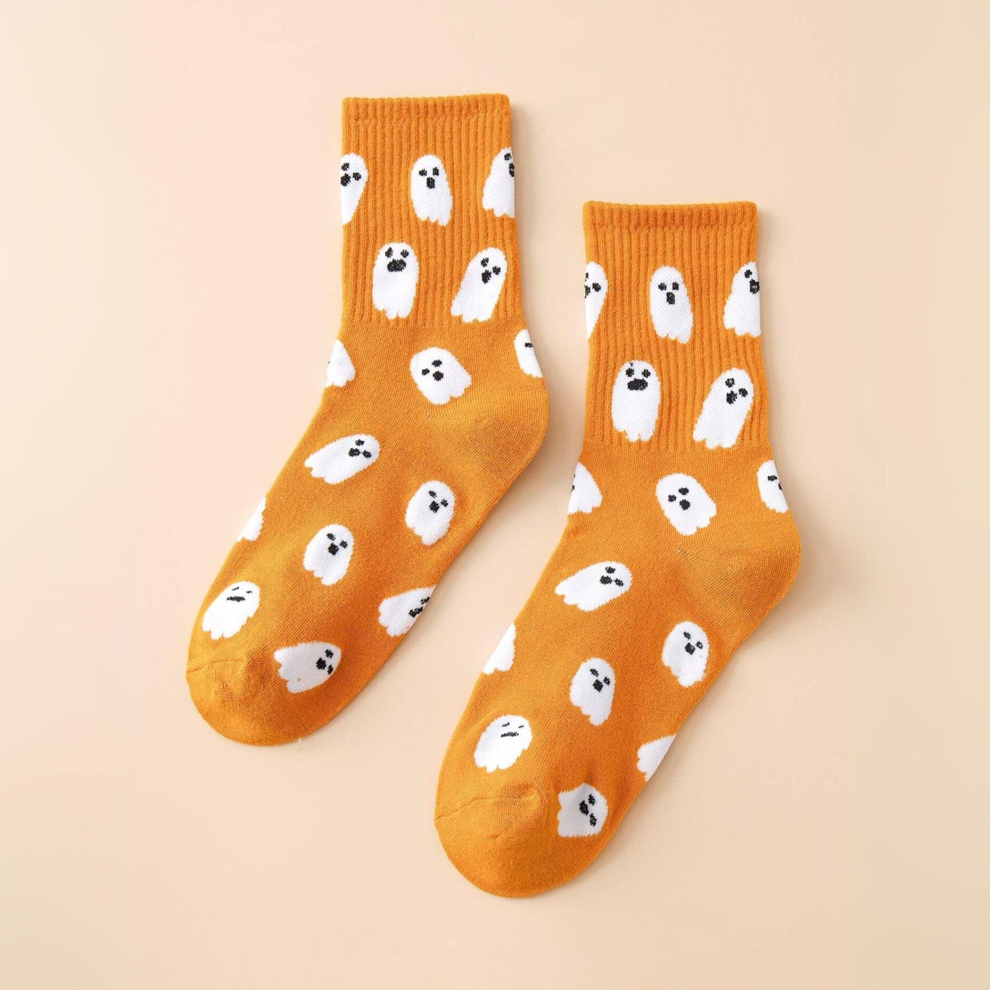 Ghost Pattern Socks featuring playful white ghosts. These mid-calf socks add festive charm and spooky fun, ideal for Halloween or quirky everyday wear.