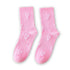 Heart Print Socks - Pink featuring embroidered white hearts on a soft background, perfect for adding a playful touch to any gift box.