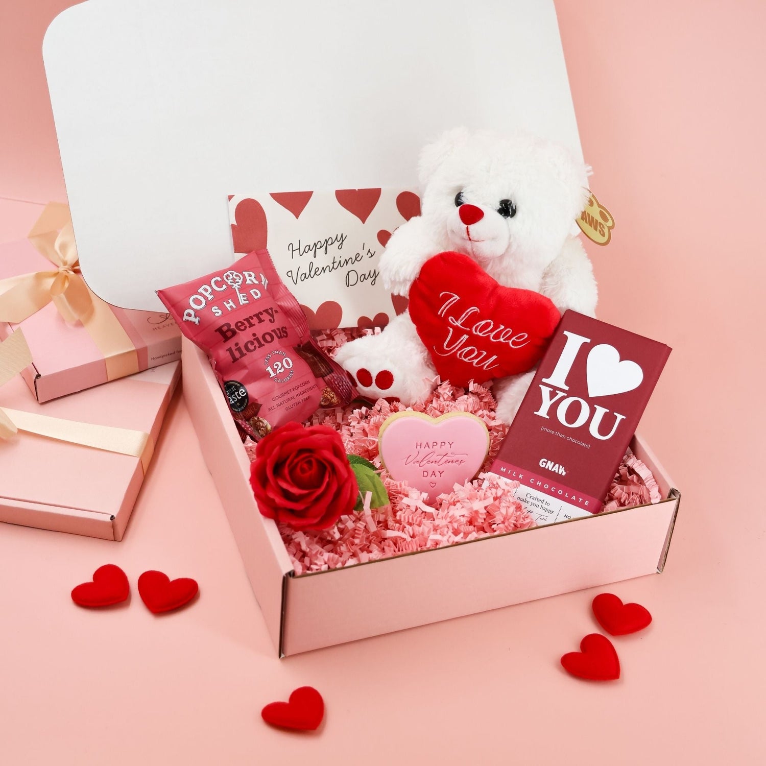 Valentine’s Day gift box for girlfriend with teddy bear, chocolate, red rose, romantic heart gifts, and luxury pink packaging. By Heavenly Boxes