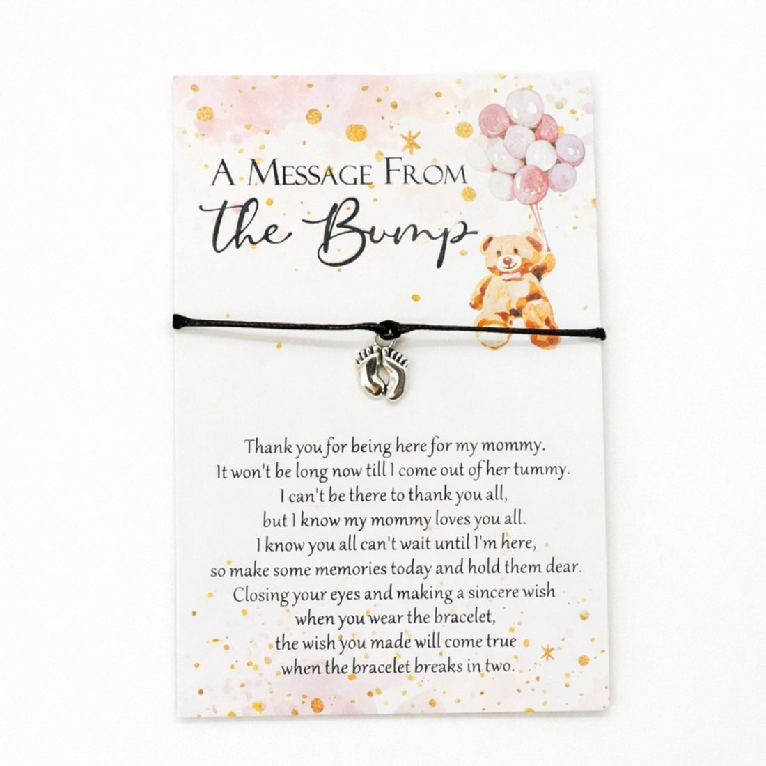 A Message from the Bump Bracelet featuring a delicate bracelet with a tiny baby feet charm on a message card, symbolizing motherhood excitement.