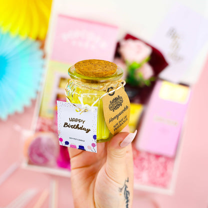 Candle close-up: “Happy Birthday soy candle from A Pretty Pink Birthday – limited edition pink pamper and treats gift box for her.
