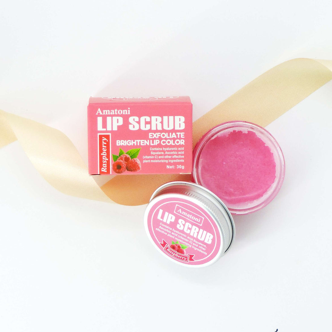 Raspberry Lip Scrub in a jar, showcasing a pink lip balm designed to exfoliate and hydrate, perfect for soft, smooth lips with a sweet raspberry scent.
