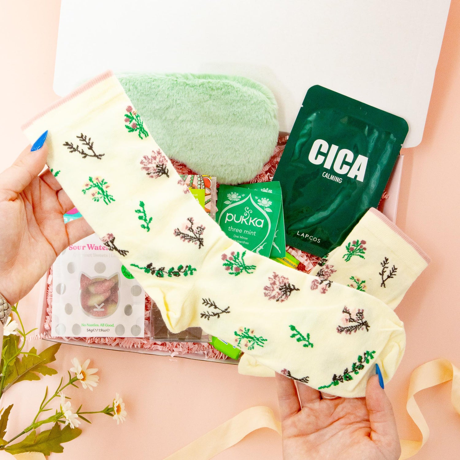 A Moment for Me pamper gift for her – cosy socks, herbal tea, face mask, eye mask and treats in a stylish green-themed self-care box.